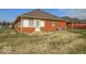 A brick home with a rear entry door and small windows, providing a glimpse of the outdoor space at 2979 Colony Lake E Dr, Plainfield, IN 46168