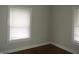 Cozy bedroom featuring neutral paint, hardwood floors, and natural light at 3160 Graceland Ave, Indianapolis, IN 46208