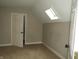Bright bedroom featuring carpet, skylight and a closet at 3160 Graceland Ave, Indianapolis, IN 46208