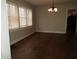 Inviting dining room features hardwood floors and a classic chandelier at 3160 Graceland Ave, Indianapolis, IN 46208