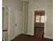 Hallway with hardwood floors and doorways leading to different rooms at 3160 Graceland Ave, Indianapolis, IN 46208
