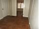Hallway features hardwood floors and doorways leading to different rooms at 3160 Graceland Ave, Indianapolis, IN 46208