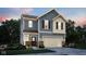 Charming two-story home featuring a large garage and a mix of blue siding and brick accents at 3302 Wetherby Pl, Danville, IN 46122