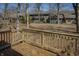 A backyard view from a wooden deck surrounded by leafless trees and other residential buildings at 4247 Larkspur Trce, Indianapolis, IN 46237