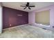 Charming bedroom featuring soft lighting, plush carpet, and a decorative wall accent, perfect for relaxation at 4247 Larkspur Trce, Indianapolis, IN 46237