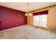 Dining room with red accent wall, light fixture, and space for entertaining at 4247 Larkspur Trce, Indianapolis, IN 46237