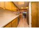 Bright kitchen featuring wood cabinets, light countertops, and a stainless steel range at 4247 Larkspur Trce, Indianapolis, IN 46237
