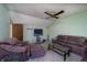 Inviting living room with neutral-toned walls, comfortable seating, and a large screen for entertainment and relaxation at 4247 Larkspur Trce, Indianapolis, IN 46237