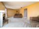 Inviting living room with neutral carpeting, stone fireplace, and ample space at 4247 Larkspur Trce, Indianapolis, IN 46237