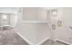 Hallway leading to the second floor bedrooms, with neutral walls and carpeted flooring at 449 Hidden Hills Dr, Pittsboro, IN 46167