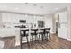 Open kitchen design with a center island and white cabinets at 449 Hidden Hills Dr, Pittsboro, IN 46167