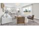 Bright living room featuring neutral tones, large windows, and stylish furniture for a comfortable and inviting space at 449 Hidden Hills Dr, Pittsboro, IN 46167