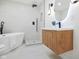 Modern bathroom showcasing a walk-in shower, sleek vanity, and freestanding bathtub at 509 St Paul St, Indianapolis, IN 46203