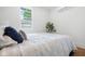 A cozy bedroom with a view from the window at 509 St Paul St, Indianapolis, IN 46203