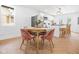 This dining room features a round table with pink velvet chairs and modern finishes at 509 St Paul St, Indianapolis, IN 46203