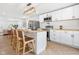 Well-lit kitchen features white cabinetry, modern appliances, and an open layout at 509 St Paul St, Indianapolis, IN 46203