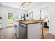 Stylish kitchen island with seating offers a glimpse into the adjacent living spaces at 509 St Paul St, Indianapolis, IN 46203
