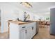 Bright kitchen features an island with a wooden countertop, black faucet, and stainless steel appliances at 509 St Paul St, Indianapolis, IN 46203