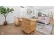 Bright living room with stylish decor, including wicker chairs and an eye-catching patterned rug at 509 St Paul St, Indianapolis, IN 46203