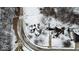 An aerial view captures the neighborhood showing snow-covered homes with tree-lined streets and snow covered lawns at 5791 Station Hill Dr, Avon, IN 46123