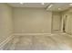 Spacious unfinished basement with neutral-colored walls, painted concrete floor, and a doorway leading to another room at 5791 Station Hill Dr, Avon, IN 46123