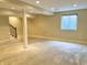 Unfinished basement with a window, support beam, recessed lighting, and stairway at 5791 Station Hill Dr, Avon, IN 46123