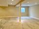 Unfinished basement with a window, support beam, and recessed lighting at 5791 Station Hill Dr, Avon, IN 46123