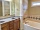 Bathroom with double sink vanity, backsplash, decorative columns and a soaking tub at 5791 Station Hill Dr, Avon, IN 46123