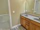 Bathroom vanity with double sinks and granite countertop, next to open door and tile flooring at 5791 Station Hill Dr, Avon, IN 46123