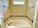 Bathroom features a soaking tub with tile surround and chrome fixtures at 5791 Station Hill Dr, Avon, IN 46123