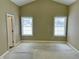 Large bedroom with two windows, ceiling fan and neutral color walls at 5791 Station Hill Dr, Avon, IN 46123
