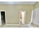 Neutral bedroom with a walk-in closet, access to a full bathroom, and natural light at 5791 Station Hill Dr, Avon, IN 46123