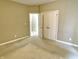 This bedroom features neutral walls, carpet flooring, and a double-door closet for ample storage at 5791 Station Hill Dr, Avon, IN 46123