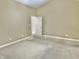 Bedroom featuring bare concrete floor, neutral paint, and view into hallway at 5791 Station Hill Dr, Avon, IN 46123