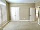 Bedroom featuring neutral carpet, neutral paint, and view into hallway and closet at 5791 Station Hill Dr, Avon, IN 46123