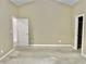 Bedroom featuring bare concrete floor, neutral paint, and view into closet at 5791 Station Hill Dr, Avon, IN 46123