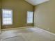Empty bedroom with two windows, ceiling fan and neutral color walls at 5791 Station Hill Dr, Avon, IN 46123