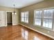 A view of the dining room with hardwood floors and plenty of natural light at 5791 Station Hill Dr, Avon, IN 46123