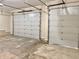 Spacious garage with two white doors providing ample parking and storage space at 5791 Station Hill Dr, Avon, IN 46123