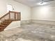 Garage features concrete floor, wood stairs leading to upper level, and plenty of space for vehicles and storage at 5791 Station Hill Dr, Avon, IN 46123