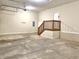 Spacious garage featuring concrete floors, stairs to an upper level, and plenty of room for storage at 5791 Station Hill Dr, Avon, IN 46123