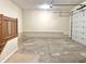 Spacious garage with unfinished concrete floors, stairs to upper level, and an electric garage door opener at 5791 Station Hill Dr, Avon, IN 46123