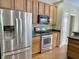 Features stainless steel appliances, wooden cabinets, and dark countertops at 5791 Station Hill Dr, Avon, IN 46123