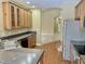 Features wood cabinets and stainless steel appliances, including a refrigerator at 5791 Station Hill Dr, Avon, IN 46123