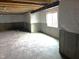Unfinished basement featuring concrete flooring, exposed ceiling and a window for natural light at 640 Firefly Ct, Greenfield, IN 46140