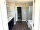 Bathroom with a glass-enclosed shower and a double vanity at 640 Firefly Ct, Greenfield, IN 46140