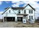 New two-story home showcasing gable roof, and framed windows ready for personalization at 640 Firefly Ct, Greenfield, IN 46140