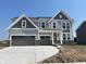 Beautiful two-story home with a three-car garage and stone accents at 640 Firefly Ct, Greenfield, IN 46140