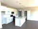 Bright kitchen features an island with a sink and white cabinetry at 640 Firefly Ct, Greenfield, IN 46140