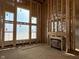 Bright living room featuring large windows and a framed fireplace, ready for personalization at 640 Firefly Ct, Greenfield, IN 46140